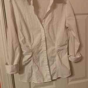 Fitted, white button down blouse thats stretchable
